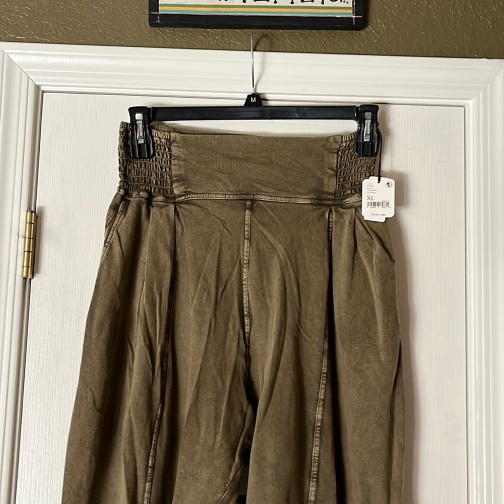 Free People pants. Harem style. Dark olive color and brand new with tags.
